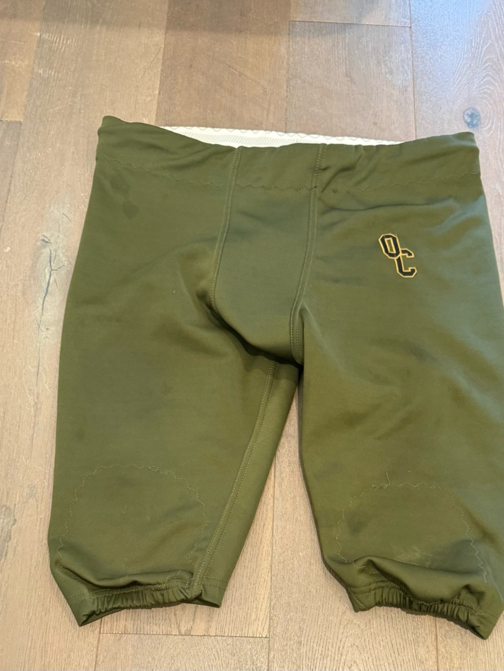 Olive Green football pants with Gold 'OC' Embroidery